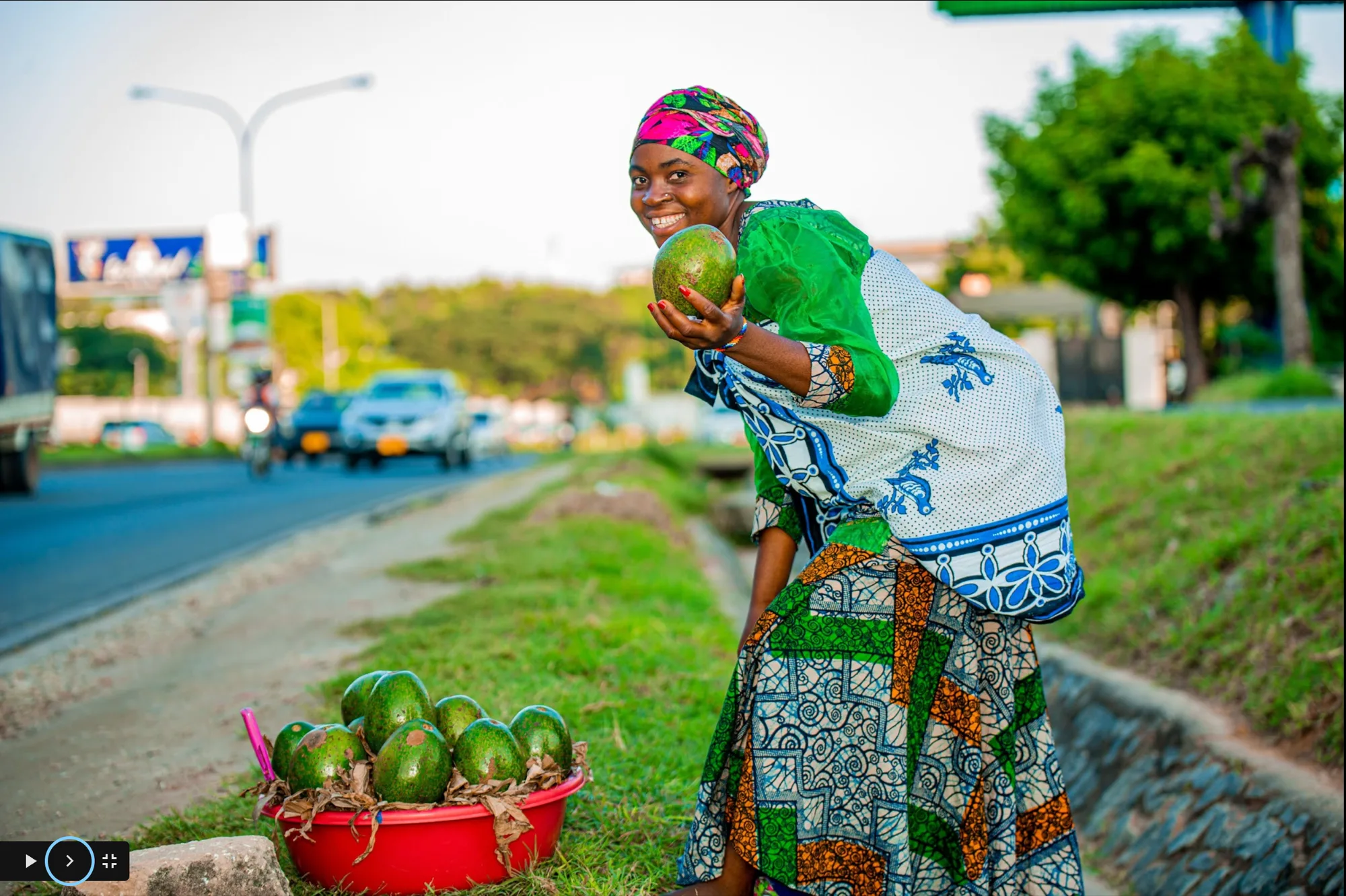 Machinga vendor selling avocados